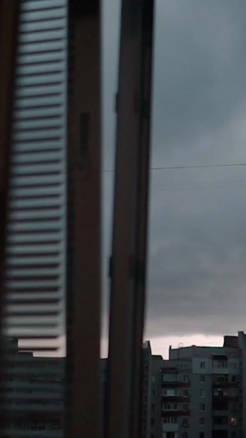 View from the window with rain clouds and lightning, sky timelapse Stock Footage 303345692