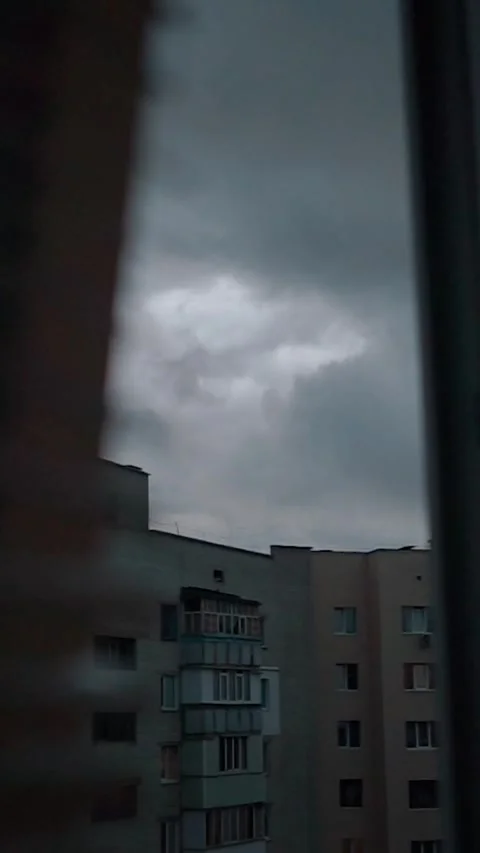 View from the window with rain clouds and lightning, sky timelapse Stock Footage 303345889