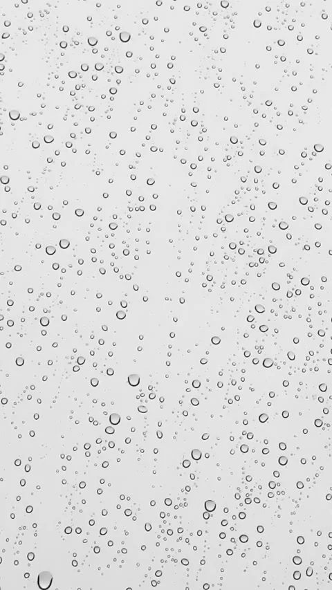 View from the window in rainy weather, raindrops on the window dripping down Stock Footage 320228668