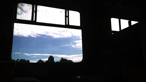 View from the window of a retro train to cloudy sky. Stock Footage 286157212