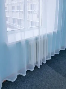 View from the window of the room through a transparent curtain on the scaff.. Foto stock