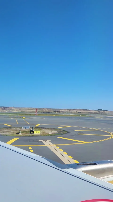 View from window shade while taxiing prepare to take off. Vertical video. Stock Footage 253972917