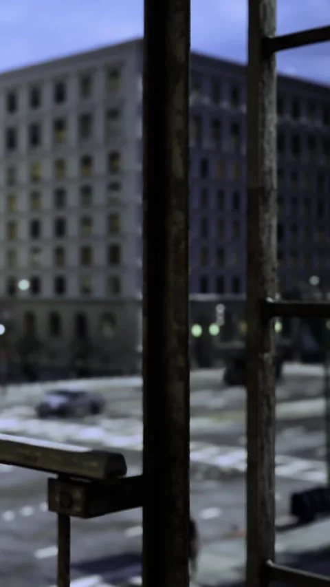 View from a window showing buildings and empty street during evening time Stock Footage 331644709