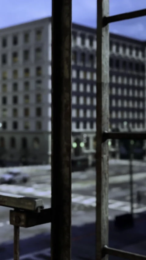 View from a window showing buildings and empty street during evening time Stock Footage 331687597
