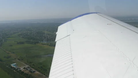 View from the window of a small passenger private plane against the backdrop of Stock Footage 144293300
