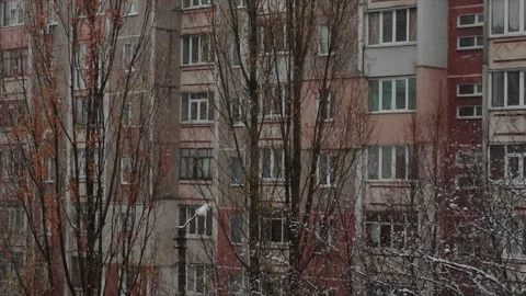 View window on snowy winter in city. Architecture eastern europe, soviet union Stock Footage 293081387