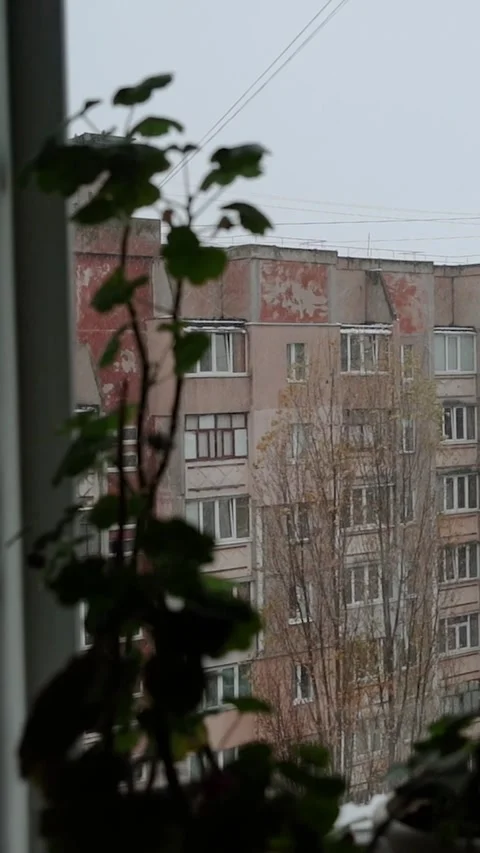View window on snowy winter in city. Architecture eastern europe, soviet union Stock Footage 293083498