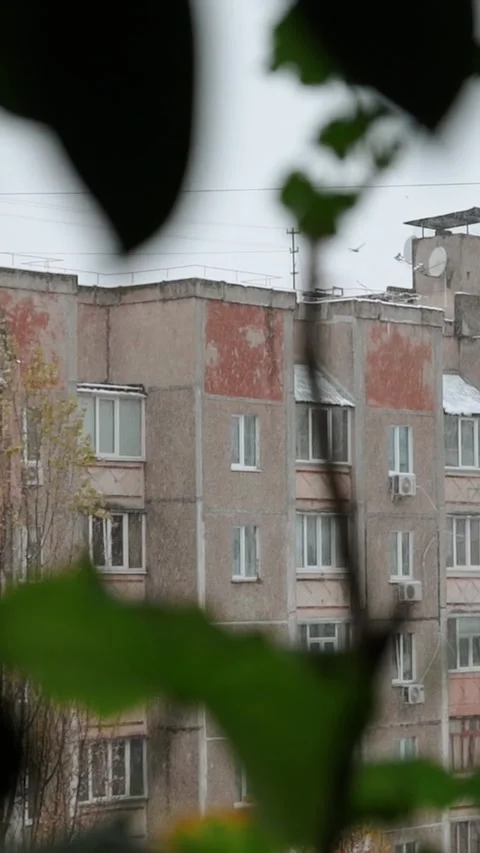 View window on snowy winter in city. Architecture eastern europe, soviet union Stock Footage 293083847