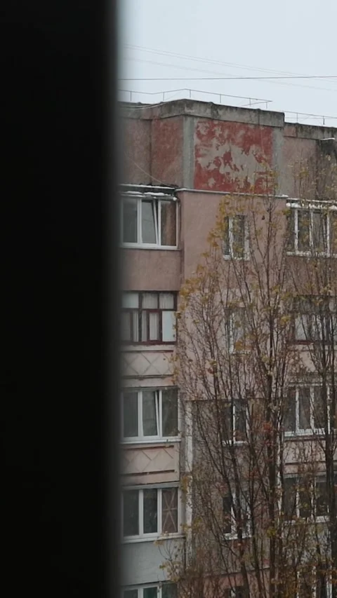 View window on snowy winter in city. Architecture eastern europe, soviet union Stock Footage 293083853