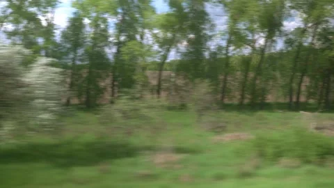 View from window of speed train with glare on glass on beautiful landscape of Stock Footage 156024166