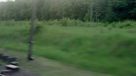 View from window of speed train with glare on glass and parallel rails on Stock Footage 156268859