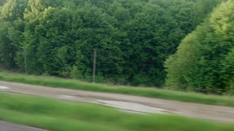 View from window of speed train with glare on glass and parallel rails on Video stock 156306915