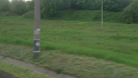 View from window of speed train with glare on glass and parallel rails on Stock Footage 156306934