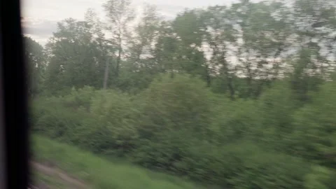View from window of speed train with glare on glass and parallel rails on Stock Footage 156380924