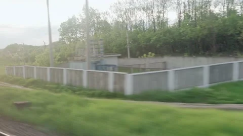 View from window of speed train with glare on glass and parallel rails on Video stock 156428617