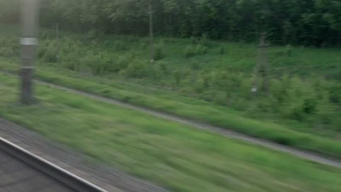 View from window of speed train with glare on glass and parallel rails on Stock-Footage 156428656
