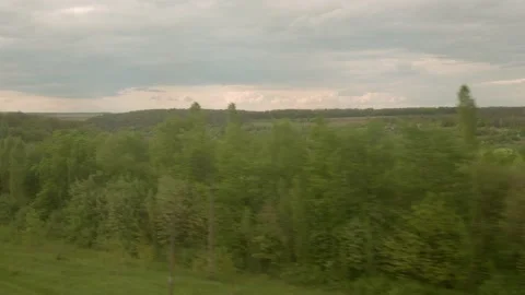 View from window of speed train with glare on glass on beautiful landscape of Stock Footage 156483038