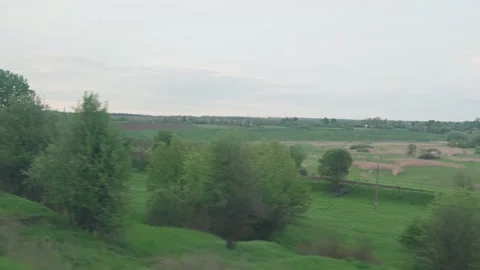 View from window of speed train with glare on glass and parallel rails on Stock Footage 156493782
