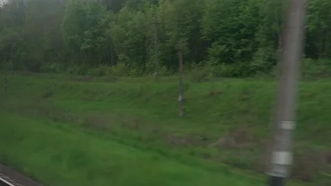 View from window of speed train with glare on glass and parallel rails on Stock Footage 156493815