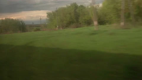 View from window of speed train with glare on glass on beautiful landscape of Stock Footage 157788571