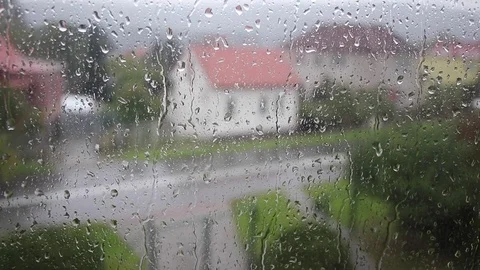 View from a window on the street in a rainy day, handheld footage Stock Footage 80676255