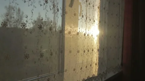 View from window on the sunrise through the curtains Stock Footage 104422530