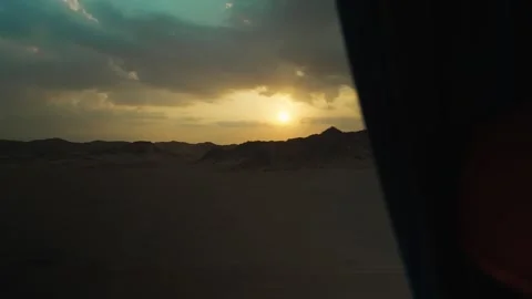 View from the window of a tourist bus at sunset in the desert area of Egypt. Stock Footage 324690606