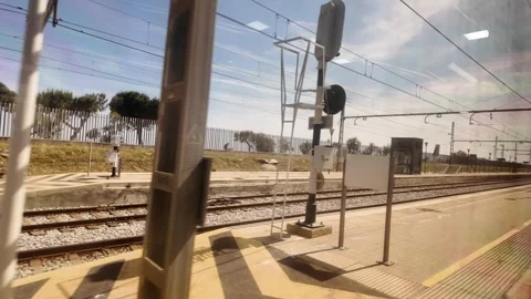 View from the window of the train arriving to Arenys de Mar, coastline trip, 4K Stock Footage 276448335