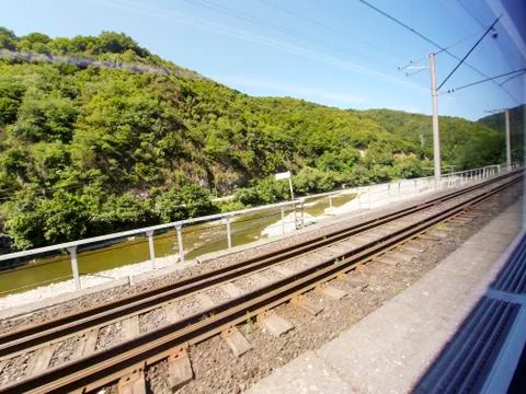 View from the window of a train car passing Stock Photos