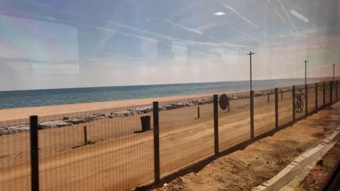 View from the window of the train going to Barcelona, coastline trip in Spain, 4 Stock Footage 276448274