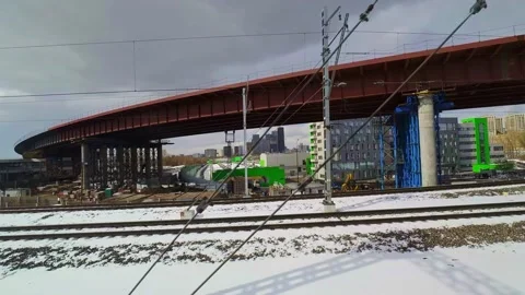 View from the window of a train moving on a railway bridge crossing a transpo Stock Footage 173552578