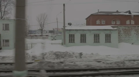 View from window of train passing by settlement Stock Footage 67844862