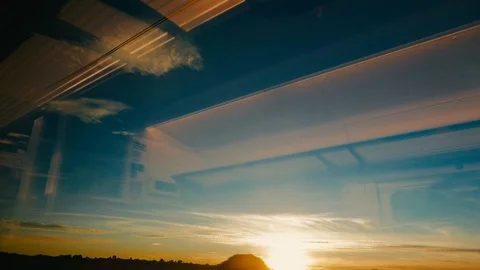 View from the window of a train at sunset Stock Footage 102694547