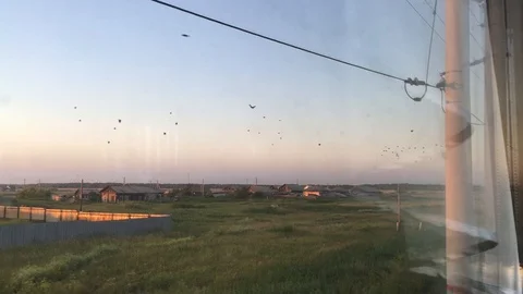 View from the window of the train to the village in summer Stock Footage 94279060