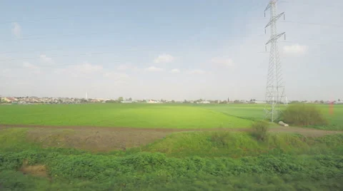 The view from the window of a train, walking along a green field Stock Footage 59941715