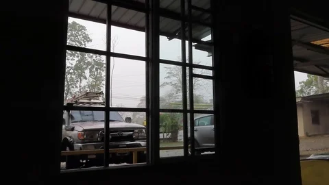 View from window of truck and hatchback in the rain Stock Footage 111233467