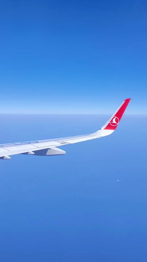 A view from the window of a Turkish Airlines plane of the wing over the endless Stock Footage 322552359