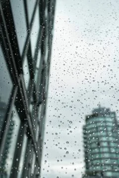 View from the window with water drops on it at rainy Day in Downtown Vancouver Stock Photos