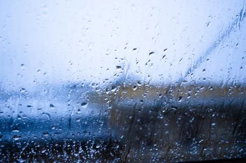 View from the window on a wet winter landscape. Wet snow and white roofs. Stock Photos