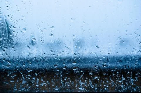 View from the window on a wet winter landscape. Wet snow and white roofs. Stock Photos