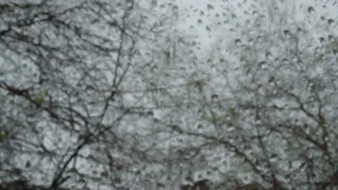View from the window on which there are raindrops. The focus of the camera mo Stock Footage 221775972