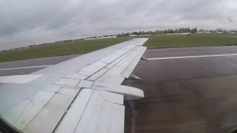 View from the Window on the Wing of a Passenger Aircraft During Takeoff Stock Footage 98318856