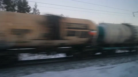 View from the window in winter on an oncoming passing freight train on the Stock Footage 146462421