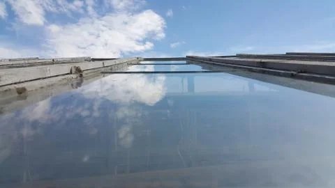 The view from the Windows of the greenhouse is transformed by clouds Stock Photos