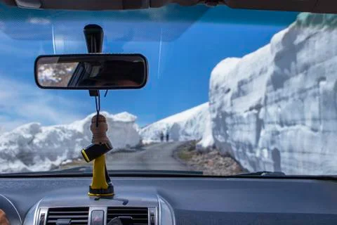 View from the windshield of a car. The road to the mountains, cleared from the Stock Photos