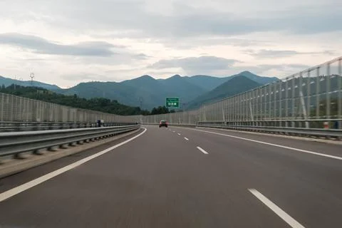 View from the windshield of empty highway in Slovakia with High Tatras mountain Stock Photos
