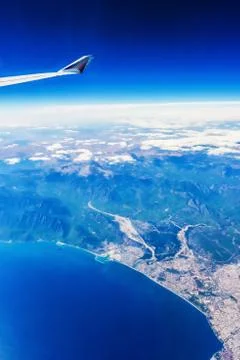 View of the wing of an airplane through the window Stock Photos
