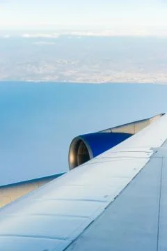 View of the wing of an airplane through the window Stock Photos