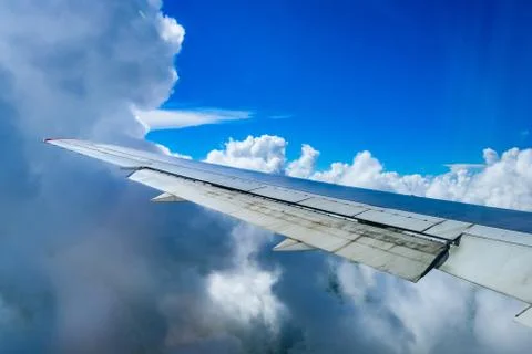View of the wing of an airplane through the window Stock Photos