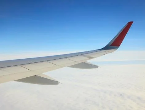 View on the Wing of airplane from window Stock Photos